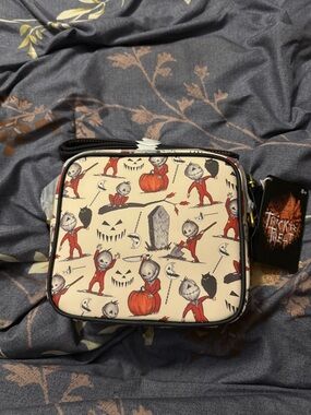 Loungefly Cream Crossbody Bag with Red Pumpkin Jack-o'-Lantern Pattern